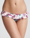 A floral-printed white ruffle over a floral-printed black bottom creates a look that is boldly pretty.