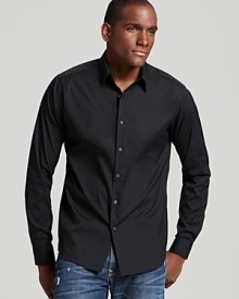 This handsome slim fit sport shirt is crafted with a touch of stretch, for an extra sleek silhouette.