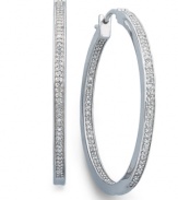 Icy cool. Round-cut diamonds (1/2 ct. t.w.) in a traditional hoop setting are a must-have for every girl's jewelry collection. Crafted in sterling silver. Approximate diameter: 1-1/2 inches.