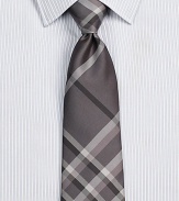 Smart checks in a sophisticated palette on pure Italian silk.About 3 wideSilkDry cleanMade in Italy