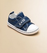 Cute, comfy classics with grip-tape closure in a denim design that'll add a little coolness to any ensemble.Grip-tape closureCanvas upperCanvas liningRubber soleTraditional Chuck insoleImported