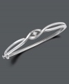 Simplicity and style twisted into one. Bangle by Wrapped in Love(tm) features two bands of sterling silver sweeping past one another with a glittering round-cut diamond (1/10 ct. t.w.) at their intersection. Approximate width: 2-3/8 inches.