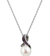 Stand out, in style. This sterling silver necklace, with a cultured freshwater pearl (8-8-1/2 mm) pendant and pink sapphire and diamond accents, proves to be quite captivating. Approximate length: 18 inches. Approximate drop: 5/8 inch.