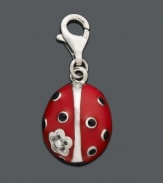 Add a touch of lady luck to your necklace or bracelet. This black and red ladybug charm is set in sterling silver with sparkling cubic zirconia accents. Lobster claw clasp. Approximate drop: 1/3 inch.