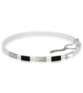 The essence of style and elegance, polished bangle looks stunning solo as well as layered with other bangles. Crafted in sterling silver with rectangular accents in onyx and Mother of Pearl. Approximate diameter: 2-5/16 x 2-5/8 inches.