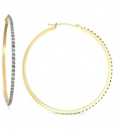 Round and resplendent. These hoop earrings are crafted from 14k gold with diamond accents providing a lustrous touch. Approximate diameter: 1-3/4 inches.