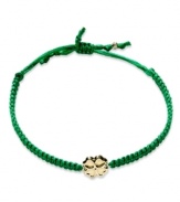 Luck stars in this bracelet. A 14k gold shamrock shines brightly in the center of this green nylon rope for a whimsically stylish effect. Bracelet adjusts to fit wrist. Approximate diameter: 3-1/2 inches.