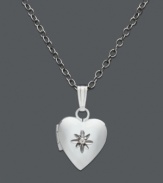 A timeless keepsake in silver. This children's heart locket features a central diamond accent. Set in sterling silver. Approximate length: 13 inches. Approximate drop: 1/2 inch.