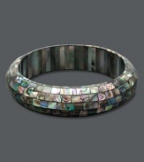 Like a beautiful piece of artwork, this stunning slip-on bangle combines tiny pieces of Mother of Pearl in a unique mosaic pattern. Approximate length: 7-1/2 inches.