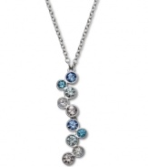 Blue mood. A gorgeous gradation of sparkling pale blue and clear bezel-set crystals adds the perfect amount of color to Swarovski's pretty asymmetrical pendant necklace. Crafted in silver tone mixed metal. Approximate length: 15-7/10 inches. Approximate drop: 1-1/2 inches.