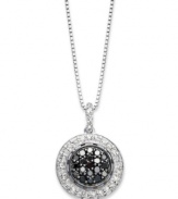 A classic combination. Black (1/4 ct. t.w.) and white (1/4 ct. t.w.) diamonds come together for a stunning effect in this pendant suspended from a sterling silver necklace. Approximate length: 18 inches. Approximate drop: 3/4 inch.