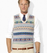 A preppy Fair Isle pattern lends handsome style to a classic V-neck sweater vest, knit in soft, smooth yarns for lightweight warmth and superior comfort.