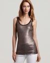 Instant glamour. Sequins add tons of shine to the Karen Kane tank top. Let it peek from beneath a jacket for a posh look, or contrast it with a vintage-style cardigan for unexpected allure.