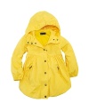 A pretty mockneck raincoat is smartly designed with an attached hood for extra protection from the elements.