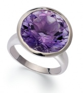 Richly colored with plenty of sparkle, this fun, bright ring features a dramatic round-cut amethyst (10-3/4 ct. t.w.) set in sterling silver. Size 7.