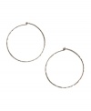 Trendy, chic, and timeless! The perfect accessory for any ensemble - these medium-sized hammered hoops by Lucky Brand feature a silver tone mixed metal setting. Approximate diameter: 2 inches.