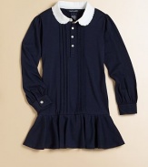 A comfortable pintuck dress in soft stretch cotton jersey is finished with ruffle details and a contrast collar for a pretty look.Peter Pan collarLong sleeves with barrel cuffsButton-frontRuffled hemCottonMachine washImported