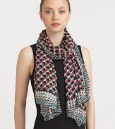 A woven modal scarf is embellished with a colorful print with contrasting border.ModalAbout 65 X 46Dry cleanImported