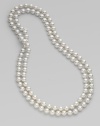 An extra long strand of round, iridescent pearls that can be worn wrapped around the neck for a classic style statement.White, organic man-made pearls Length, about 48 Made in Spain 