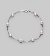 From the Akoya Collection. A delicate chain, sprinkled with lustrous white cultured Akoya pearls. 5mm white, round cultured pearls Quality: A+ 18k white gold Length, about 7 Spring ring clasp Imported