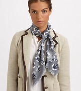 A charming floral print and zig-zag fringe add unique style to a wool scarf.WoolAbout 45 X 45Dry cleanImported