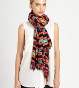 Wearable art takes a new form on this lightweight scarf adorned with a vibrant, tribal-inspired print and allover fringe trim.Viscose44 X 78Hand washImported