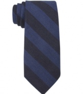 Bold bar stripes make a solitary statement on this skinny tie from Tommy Hilfiger.