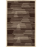 Light and dark tones of brown and beige collide to produce this dynamic piece, designed by Surya's world-renowned artisans. Transforming any decor from static to stirring, the Studio Rowe area rug uses hand-tufted New Zealand wool to create an ultra-soft surface that lasts in the most high-traffic environments.