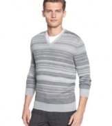 Layer me over a t-shirt and you'll create a relax pull together look with this striped merino v-neck sweater by Calvin Klein.