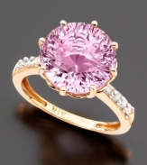 An intriguing feminine design. A round-cut pink amethyst (6-3/4 ct. t.w.) in a 14k rose gold setting with twinkling diamond accents on both sides of the band.