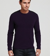 A Victorinox crewneck sweater features shoulder and elbow patches, reinforcing a refined military-inspired look.