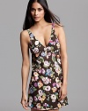 Make a stylish bedtime statement in this colorful floral print chemise with a plunging V-neckline.