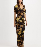 A gorgeous floral print with a curve-hugging maxi-dress fit creating a stunning and elongating coverup. V-neckShort sleevesPull-on style87% nylon/13% spandexHand washImported