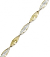 The perfect twist of two-tone metallics. Giani Bernini's versatile bracelet combines links of sterling silver and 24k gold over sterling silver. Approximate length: 7-1/2 inches.