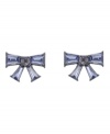 Feminine flair. Add a lovely, ladylike look to your style with Betsey Johnson's dainty bow stud earrings. Set in hematite tone mixed metal, they're embellished with violet-hued baguette crystals. Approximate drop: 1/2 inch.