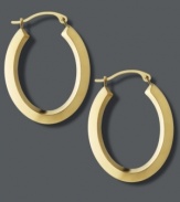 Frame your face with the perfect accent piece. Traditional hoop earrings receive a modern update with a chic, oval shape in polished 18k gold. Approximate drop length: 1 inch. Approximate drop width: 3/4 inch.