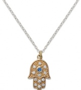 Symbolic and stylish, Studio Silver's contemporary pendant features a blue and clear crystal-accented Hamsa. Set in 18k gold over sterling silver and sterling silver. Approximate length: 18 inches. Approximate drop: 1/2 inch.