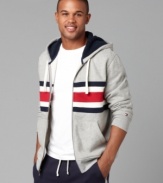 A dose of nostalgia in a bold bar stripe, this Tommy Hilfiger hoodie shows an iconic trio of hues.