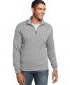 The heritage cable-knit design of this classic quarter-zip sweater from Izod lends instant polish to any casual combo. (Clearance)