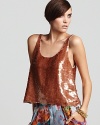 Liquid-like sequins shimmer on this BCBGMAXAZRIA tank for haute party style. Flaunting a scalloped hem for a touch of femme, this luxe look is a major masterpiece.