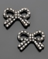 Finish your look with some girly glitz. These Betsey Johnson bow earrings are crafted in hematite-plated mixed metal and crystal accents. Approximate width: 1/2 inch.