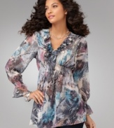 Ruffles and a mixed snakeskin print add up to serious sizzle on Sienna Rose's flowing tunic! (Clearance)