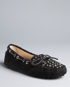 These KORS Michael Kors moccasin flats combine driving loafer style with fierce, stud accents.