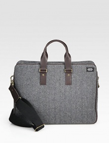 Inspired by suiting fabrics, this wool herringbone is a classic men's fabrication, complete with a leather strap and handles and interior functionality including a laptop sleeve and zip pocket.Zip closureDouble top handlesAdjustable shoulder strapWool/leather17W x 13H x 6DImported