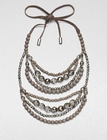 Multiple strands of faceted glass and wooden beads, suspended from a supple suede tie.Glass and wood beadsMetal-tipped suede tie closureDrop, about 14Made in Italy