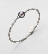 A stunning grey pearl on a textured, rhodium-plated stainless steel bangle. 12mm organic grey round man-made pearlRhodium-plated stainless steelDiameter, about 2.5Slip-on styleImported