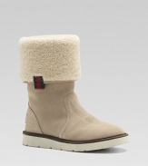 Sporty suede boots, cuffed and lined in curly, cozy shearling fleece.Suede upper Shearling cuff and lining Rubber sole Made in Italy