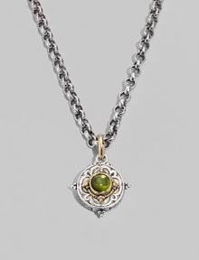 Chic little accent in gleaming sterling silver and 18k gold, centered with a smooth cabochon peridot stone. Chain sold separately About ½ diam Imported