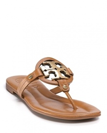 Gleaming studs and logos add signature Tory Burch charm to these luxe leather thongs.