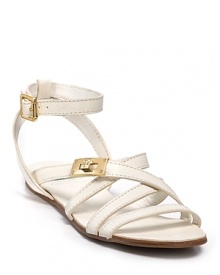 In crisp, summery white with golden accents, Tory Burch's strappy sandals have us longing for vacation. Pair with a beachside cocktail.